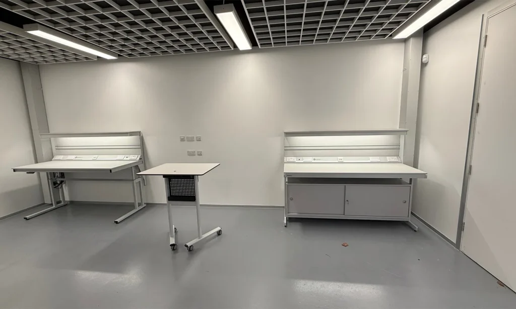 Interior of the Leicester Aeronautical College technical training facility showing bespoke engineering and electronics workbenches with integrated power, lighting and fume extraction, designed to support advanced aerospace, electronics and engineering education at Level 4 and Level 5.