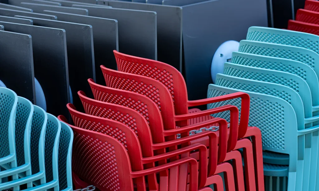 stacked colourful school chairs