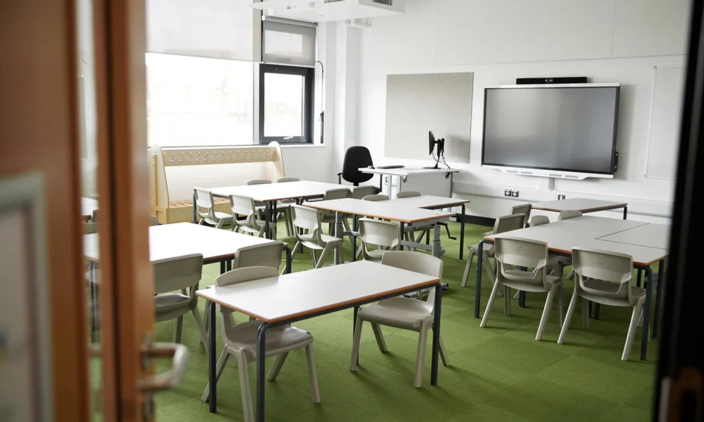 empty school classroom with chairs and tables