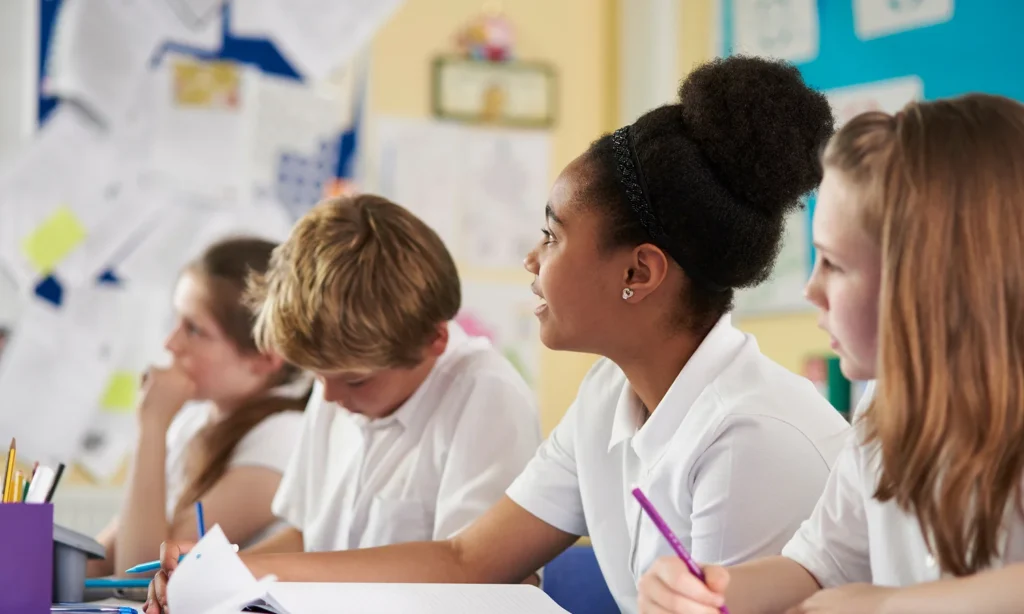 primary school pupils paying attention in class